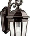 Courtyard 1 Light Outdoor Wall Light With Clear Seeded Glass In Rubbed Bronze For Entry Or Garage Doors Weatherproof Wet Rated Exterior Fixture With Classic Coastal Style showcasing curled metal design.