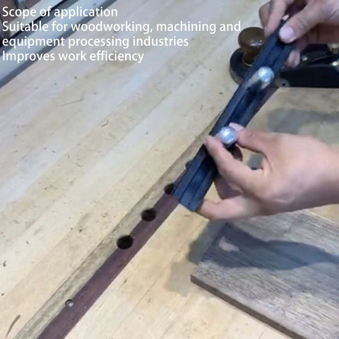 Hands holding Beefy Aluminum Planing Stop Board For Woodworking Your Go To Workbench Baffle Durable Alloy Stop That Installs Easy With Wood Or Metal 19mm Thick Stable And Planing Ready Multi Material Compatibility over workbench