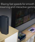 Nighthawk WiFi 7 Router Dual Band With Blazing 6.5Gbps Speeds next to gadgets on a shelf, ideal for streaming and gaming.