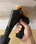 Popcorn Ceiling Scraper Vacuum Attachment for Shop Vacuums being used on unpainted ceiling for mess-free texture removal