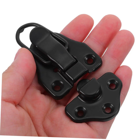 8 Pack Retro Duckbill Toggle Latch Locks For Jewelry Boxes, Toolboxes, And Suitcases in hand showing black finish and stainless steel