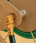Close-up of Built Tough Heavy Duty Steel Garden Hose Reel Wall And Floor Mount, hose coiled on industrial grade tan reel
