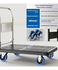 Heavy Duty Foldable Rolling Dolly, No Sweat Hauling With Silent Wheels, Space Saving Steel Frame Pushcart For Quick Home Moves And Warehouse Jobs, Solid Blue Build with durable wheels and steel armrest.
