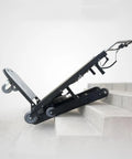 Heavy Duty Electric Stair Climbing Dolly Cart With 550 Lb Load Capacity And Powerful 500W Motor For Easy Moving Jobs Made Simple With Fast Charging Battery on stairs