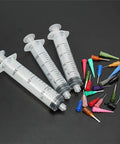 20 to 30cc Syringe Flux Dispenser For SMT SMD PCB Soldering Paste with colorful needle tips on black background
