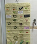 Keep Your Jewels In Check with This Double Sided Hanging Jewelry Organizer featuring 80 transparent pockets for accessories.