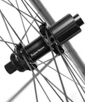 Close-up of Tubeless 45mm Carbon Road Wheelset With 700c Rims And 25mm Tires Disc Brake Compatible hub and spokes