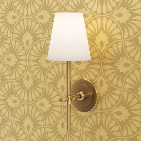 Glow Up Your Space With Top Shelf Abstract Scalloped Gold Metallic Wallpaper For Modern Interiors with a gold wall sconce.