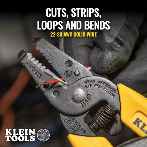 Close-up of compact lightweight wire stripper and cutter on 22-30 AWG solid wire, showing precision ground jaws and yellow handle.
