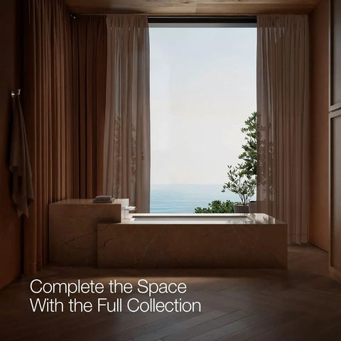 Modern bathroom with large window, marble tub, and ocean view, showcasing "Complete the Space With the Full Collection" text.