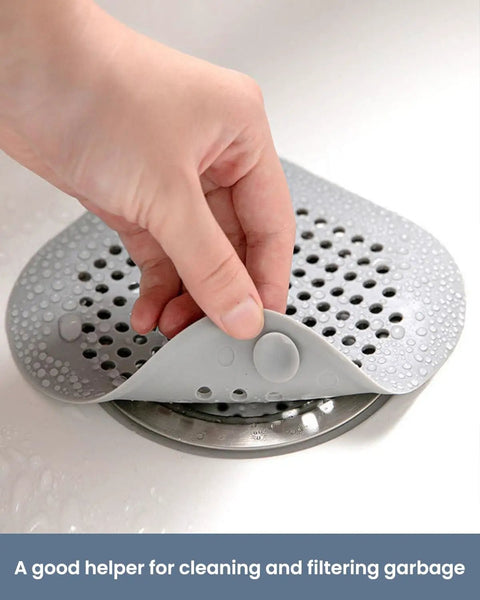 Heavy Duty Two Pack Square Hair Drain Catcher And Tub Filter With Grip Tight Suction Pads To Keep Your Shower Bathtub And Kitchen Sink Totally Clear Grey being removed from a drain.