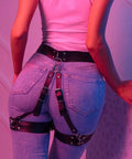 Premium Adjustable Punk Leather Thigh Harness For Women Durable Soft PU Waist Leg Garter worn with blue jeans from the back.