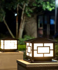 Outdoor Pillar Lights Modern Rustic Aluminum Post Lights with glass shade illuminating a garden path at night