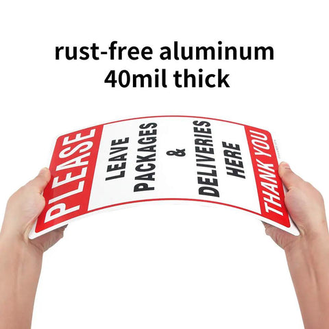 Leave Your Packages Here Heavy Duty Aluminum Front Porch Drop Off Sign 12X8 Inches held in hands showing 40mil thickness.