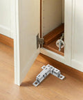 Healeep 10PCS Copper Door Catch With Silent Close Function For Kitchen Cabinets showing a silver latch installed on a cabinet door.