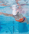 Swimmer using Long Belt Slider Swim Resistance Belt Red For In Pool Training 12 To 31 Lbs In Water Swim Tubing Trainer for strength.