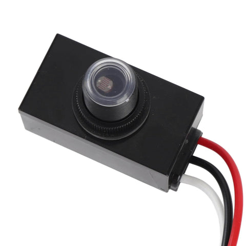 Black rectangular Exterior Dusk To Dawn Photocell Sensor with Auto On Off for Outdoor Lights, featuring red and black wires.