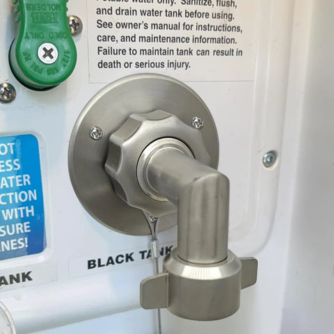 Stainless steel 90-degree hose elbow connector installed on an RV water inlet with 3/4-inch GHT threads