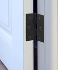Door hinge, black metal, 3-inch, installed on a white door frame with six screws visible.