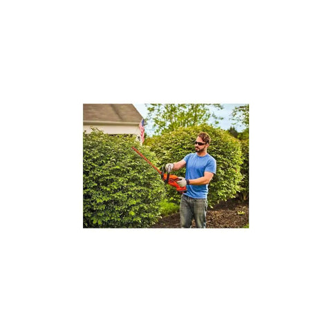 Man using 40V Max Cordless Hedge Trimmer With A 22 Inch Cut Dual Action Steel Blades For Reduced Vibration Lightweight And Easy To Maneuver