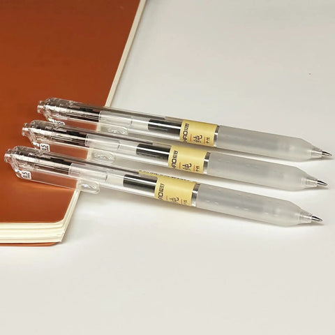 3-piece 12 Pack 0.5mm Gel Pens Retractable Black Ink Set For Smooth Quick Dry Writing No Smudge Bold Fine Point placed on a notebook
