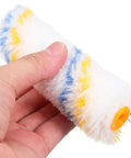 Hand holding a high density foam cover from the 20 Pack Mini Paint Roller Kit With High Density Foam Covers For Snappy Spot Touch Ups And Crisp Trim Lines Delivers A Flat Coating That Truly Takes No Sweat Off Every DIY Home Refresh Job.