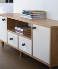 Fresh Round Matte Black Drawer Knobs 1.2 Inch Cabinet Hardware 10 Pack With Mounting Screws on white cabinetry with books.