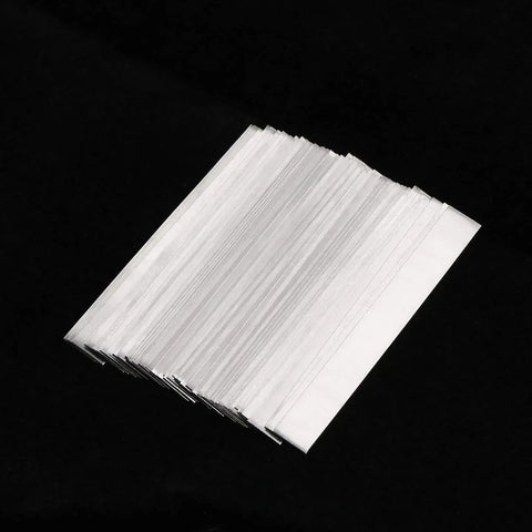 Stack of Pure Nickel Strip 99.6 Percent Nickel 0.15x6x50mm Solder Tabs for Battery Packs on black background