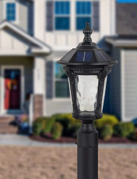 Solar Outdoor Post Light With Two Modes Aluminum Exterior Lantern in front of house, shown in daylight.