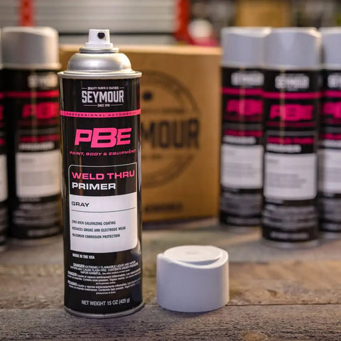 Professional Self Etching Weld Through Gray Primer For Metal Surfaces With Zinc Enhanced Coating canister on wooden surface.
