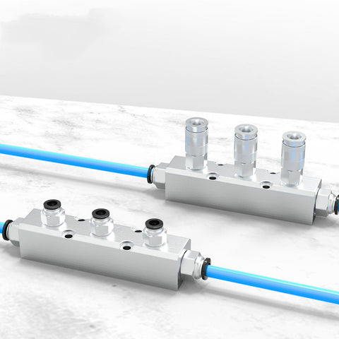 Built To Last Aluminum Air Manifold For Shop Use 3 Way 5 Port Pneumatic Block Splitter With One Quarter Inch NPT Output And One Half Inch NPT Supply Port For Industrial Workshop on white background with blue hoses attached