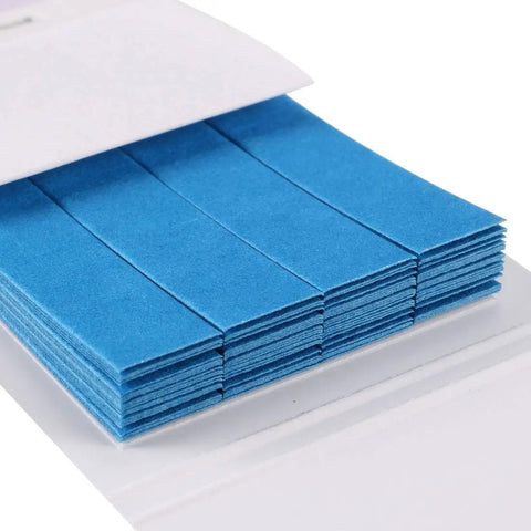 Close-up of Easy Read pH Test Strips 0.5 To 5.0 Indicator Paper Kit, blue litmus strips stacked in booklet for water testing