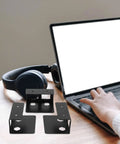 Heavy Duty Under Desk Laptop Mount Rack Designed For A No Sweat Install To Claim Back Prime Desk Real Estate While Securely Parking Laptops Tablets Routers And Keyboards, black steel brackets on wood table.