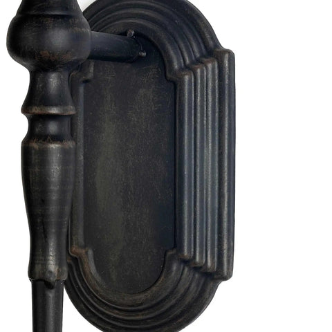 Close-up of handcrafted iron crown scepter mount from Kick Up Your Living Room Vibe With These Dope Black Gothic Wall Sconces Set Of Two.
