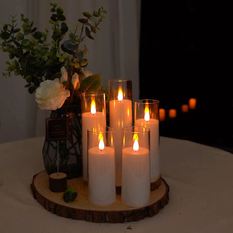 Set Of 5 Battery Operated Flameless LED Pillar Candles With Acrylic Shell, Remote Control And Timer, on wooden tray.
