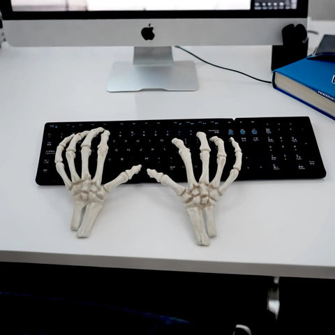 Left And Right Skeleton Hands 8 Inch Spooky Bones Halloween Decor on keyboard, realistic bone look, Crazy Bonez line