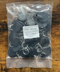 50 Pcs Pack Re-Writable RFID Hotel Key Fobs For 13.56MHz Locks in clear plastic bag on wooden surface