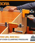 Top Shelf 18 Inch Parallel Clamps 2 Pack Woodworking Tools Built With Wide Padded Jaws And An Easy Passive Lock To Deliver A Rock Solid 1100 Lbs Of Even Pressure For Pro Shop Projects And Weekend Builds In Rustic Brown, demonstrating clamping on wooden cabinets.