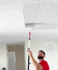Man using 12 Inch Drywall Compound Roller For Fast Coverage On Walls And Ceilings High Performance Pro Tool To Lay Down Joint Compound