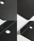 Close-up of Straight Fire Black Metal Floating Wall Shelf for Echo Dot showing smooth finish, center hole for cord routing.