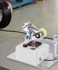 Rock Solid Wire Rope Length Counter With Alarm Digital Measuring Wheel For Cable Textile Trades, measuring cable on work table.