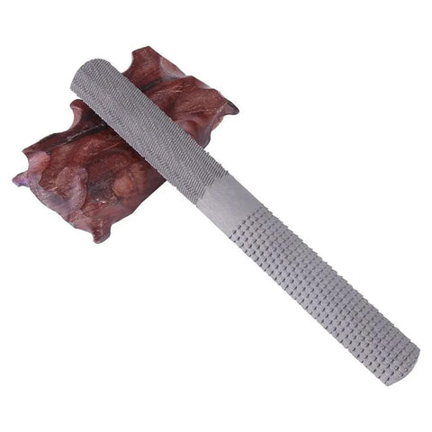 Eight Inch 4 Way Rasp File Forged From Toughened Carbon Steel designed for woodworking and metalworking on a wooden base.