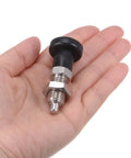 Top Shelf Stainless Steel Ball Nose Spring Plunger Set With Push Fit Design And M12x1.5 Thread Holding A Solid 6mm Pin in hand.