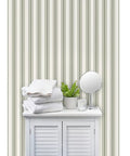 Grain Sack Stripe PVC Free Wallpaper Featuring Refined Linen Texture in a bathroom setting with towels and a mirror.