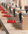Image of Heavy Duty General Purpose Clamp With Zinc Die Cast Jaws Delivers Up To 330 Pounds Of Clamping Power in use on wooden workbench