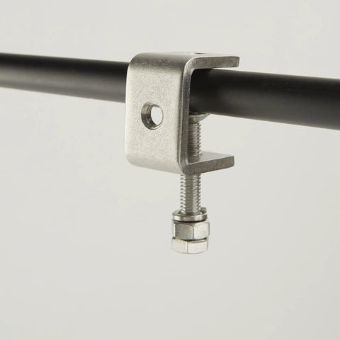 Close-up of a 1-inch 304 stainless steel C-clamp gripping a black metal rod
