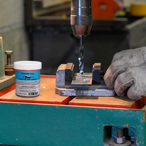 Boss Grade Synthetic Lubricant Paste for MQL Metalworking Industrial Pink Hard Paste 4 oz with drill in use