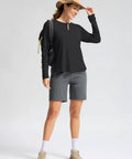 Woman wearing Women's UV Protection Sun Shirt With UPF 50+ Long Sleeve Lightweight Quick Dry Moisture Wicking Breathable Trail Ready Top For Hiking, Running, Travel, And Outdoor Workouts Black, Size M