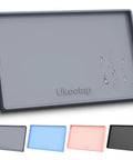 Gray leakproof silicone mat with raised edge, extra thick under sink mat for kitchen and bathroom, waterproof and spill proof.