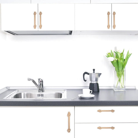 Installed 5 Inch Center-To-Center Champagne Bronze Cabinet Pulls, showcasing 6.2 Inch Length, gold hardware in modern kitchen setting.